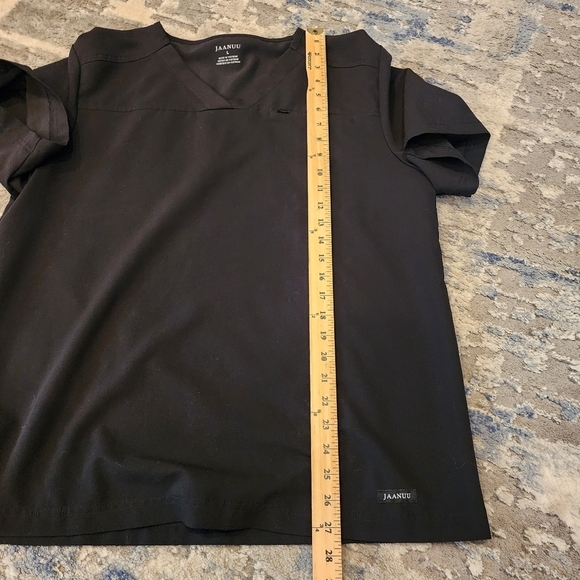 Jaanuu black scrub top. 1 zip chest pocket.  Short sleeve v-neck. Women's size L - Picture 9 of 14